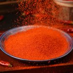 Huaxi fine-ground chili powder on a glass plate