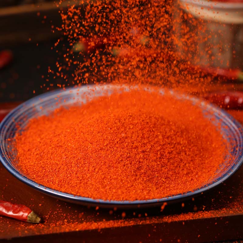 Huaxi fine-ground chili powder on a glass plate