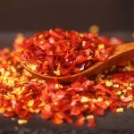 Erjingtiao coarse chili flakes on a wooden spoon