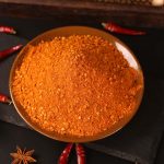 Five-spice chili dipping seasoning on a brown plate