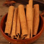 Cinnamon bark in a wooden bowl