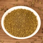 Green Sichuan pepper powder in a small white dish