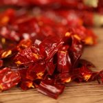 Erjingtiao dried chili segments heaped on a wooden table