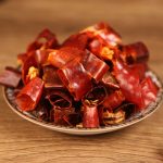 Huaxi dried chili segments on a ceramic plate