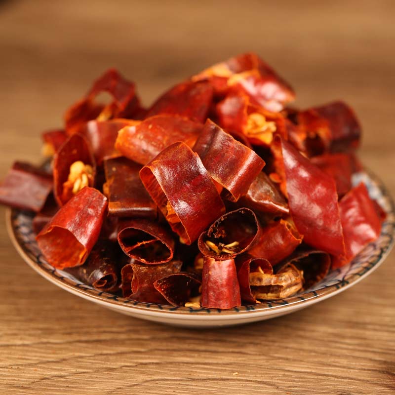 Huaxi dried chili segments on a ceramic plate