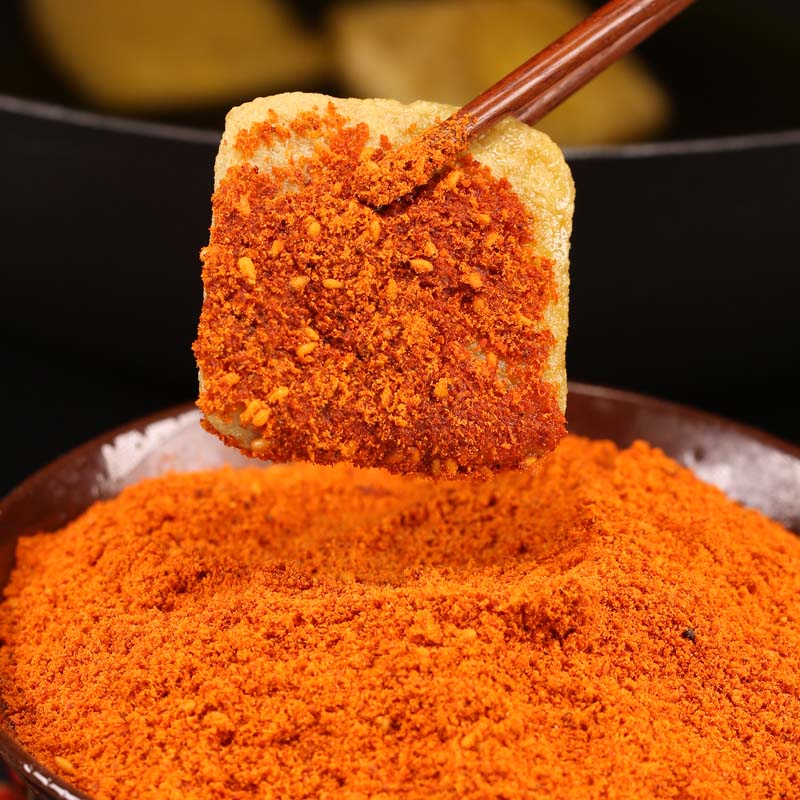 Mala chili dipping seasoning coating a skewered piece of food