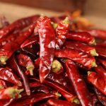 Tiaozi dried chili peppers on a wooden table
