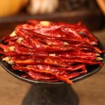 Xiaomila chili threads on a black stand