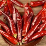 Huaxi dried chili peppers in a blue bowl