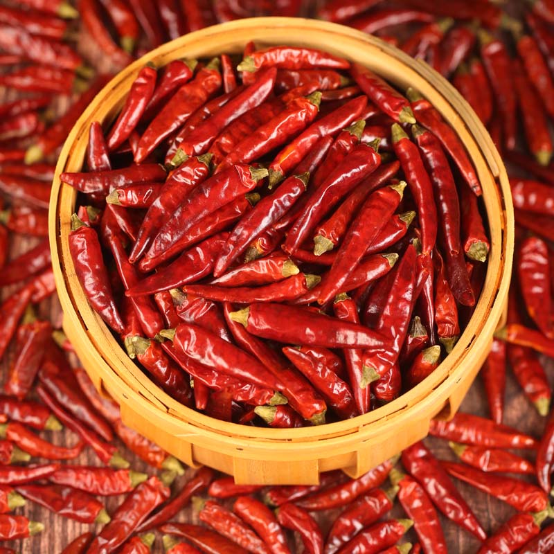 Mantianxing dried chili peppers in a round bamboo basket