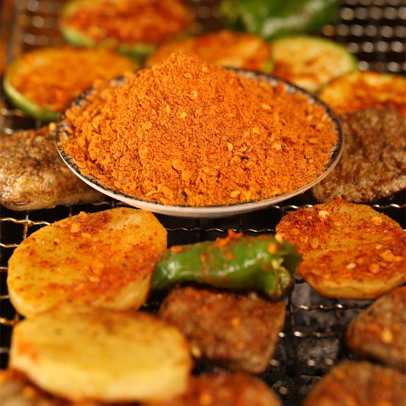 Five-spice chili dipping seasoning beside grilled vegetables