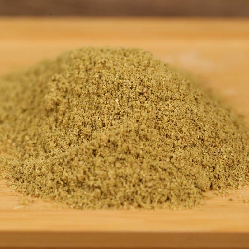 Ground fennel mounded on a wooden board