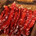 Erjingtiao dried chili peppers heaped on a bamboo mat
