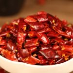 Mantianxing dried chili segments heaped in a white dish