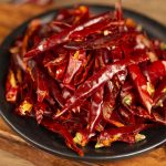 Tiaozi chili threads heaped on a dark plate