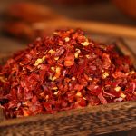 Xiaomila crushed chili flakes on a wooden tray