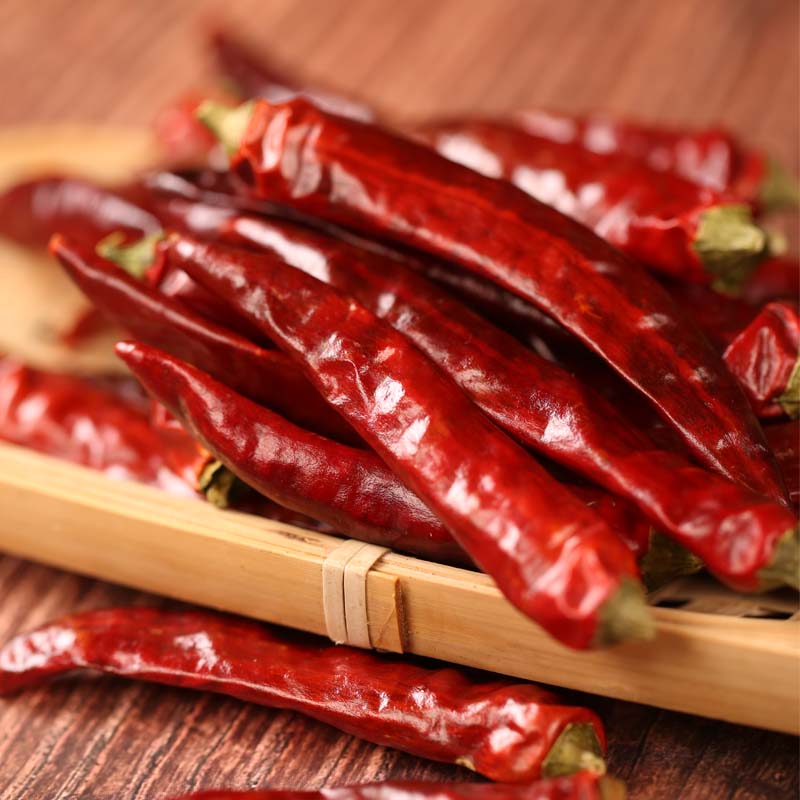 Tiaozi dried chili peppers on a wooden tray