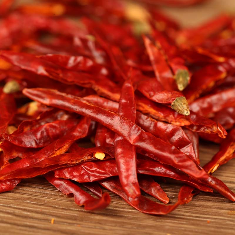 Xiaomila chili threads in close-up on a wooden table