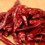 Xinyidai dried chili peppers on a bamboo tray